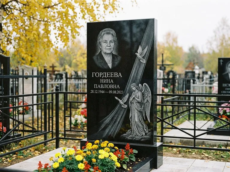 Памятник с гравировкой ангела — гравировка ангела с голубем по диагонали стелы, работа «Гордеева» в Калининграде